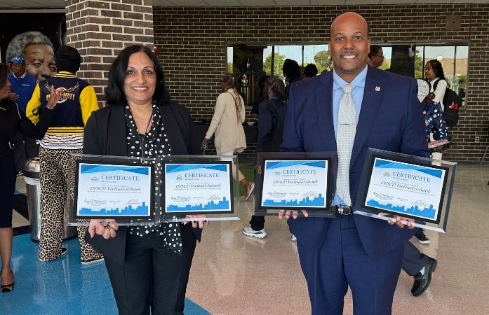  Dr. Sandhu and Mr. Lake smiling and holding the Virtual School aware certificates